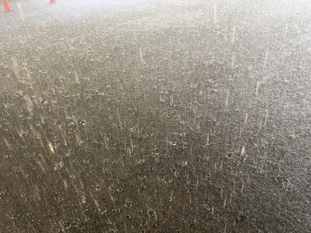 A photo of artificial rain from the rainwater simulator at NIED